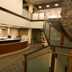Front desk office tour view with the stairs in the view