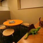 Waiting room & children's area with dinosaurs toys on shelf 