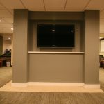 Waiting room with TV screen and chairs 
